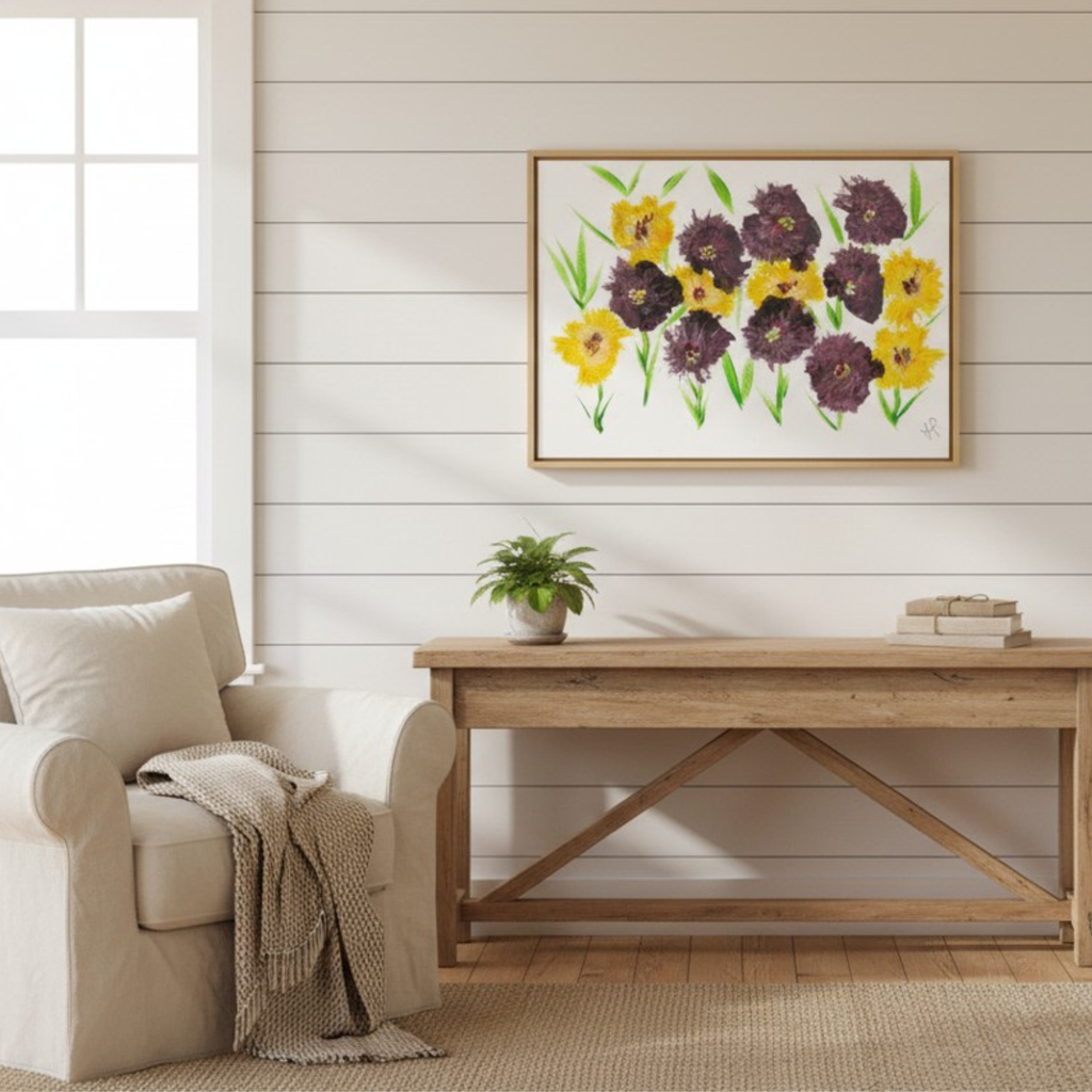 Art with flowers in living room with a beige armchair to depict nature artwork.